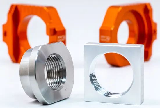 Works Orange Aluminum Elite Axle Block Pair 2