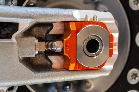 Works Orange Aluminum Elite Axle Block Pair 1